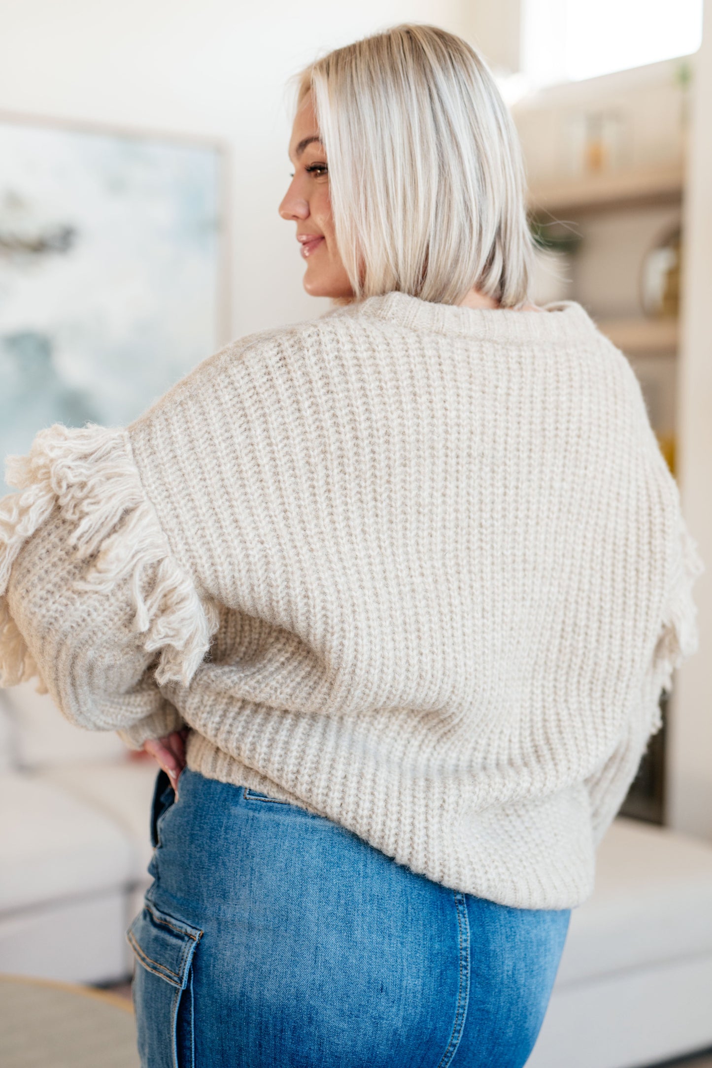 Beige long sleeve Mid-Weight sweater Sweater Knit
V-Neckline
Looped Fringe
Button Front
50% Recycled Acrylic, 50% Acrylic
True to Size