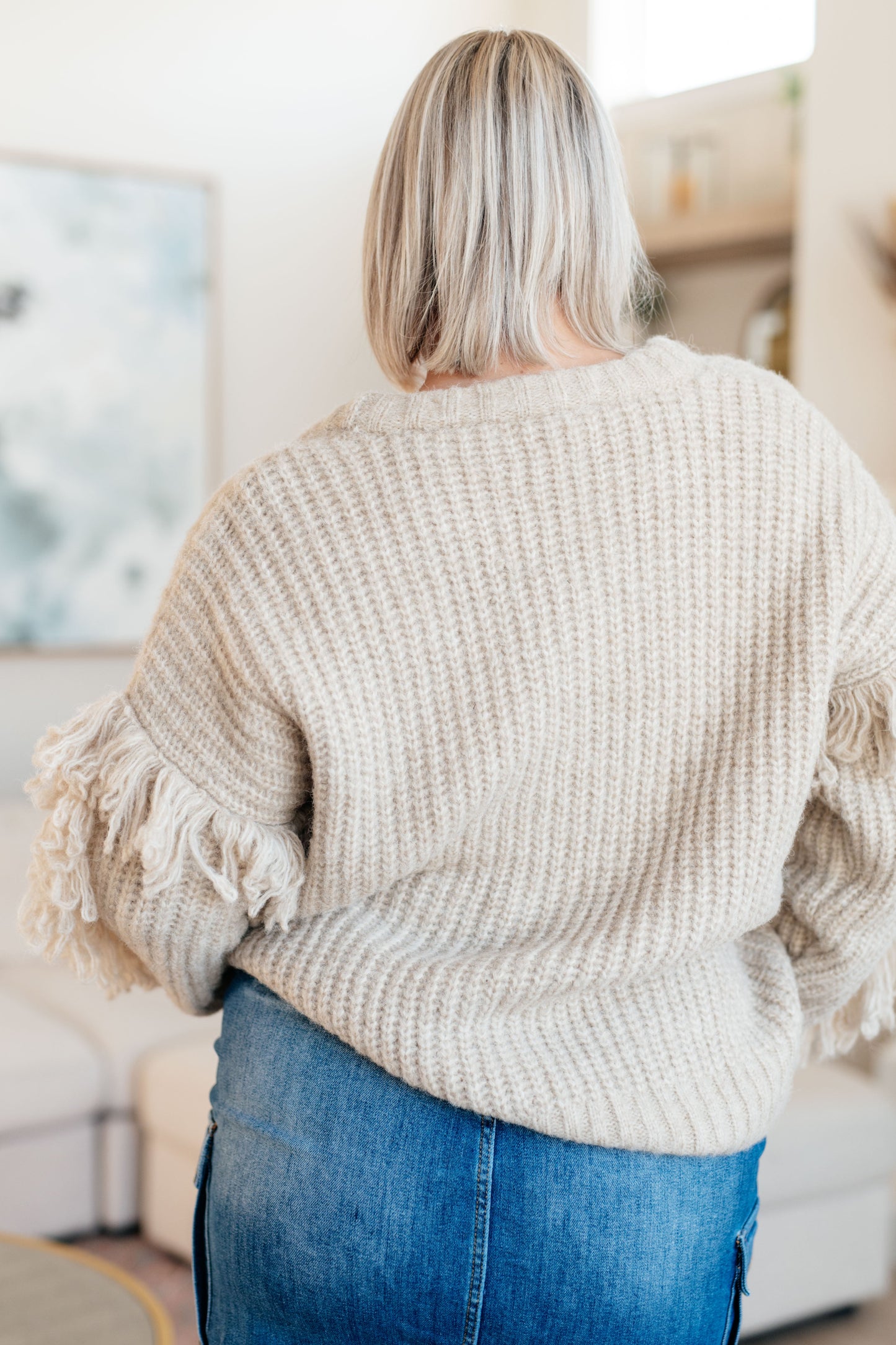 Beige long sleeve Mid-Weight sweater Sweater Knit
V-Neckline
Looped Fringe
Button Front
50% Recycled Acrylic, 50% Acrylic
True to Size