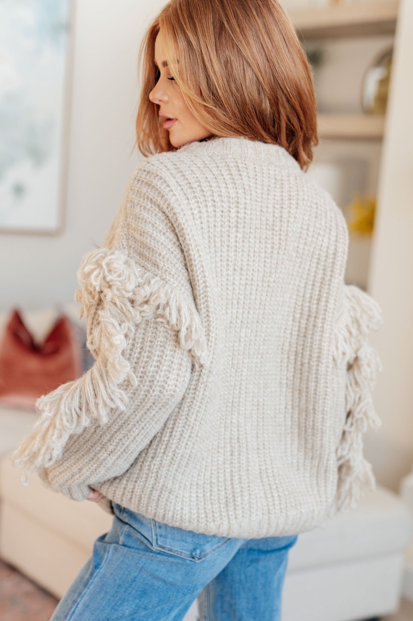 Beige long sleeve Mid-Weight sweater Sweater Knit
V-Neckline
Looped Fringe
Button Front
50% Recycled Acrylic, 50% Acrylic
True to Size