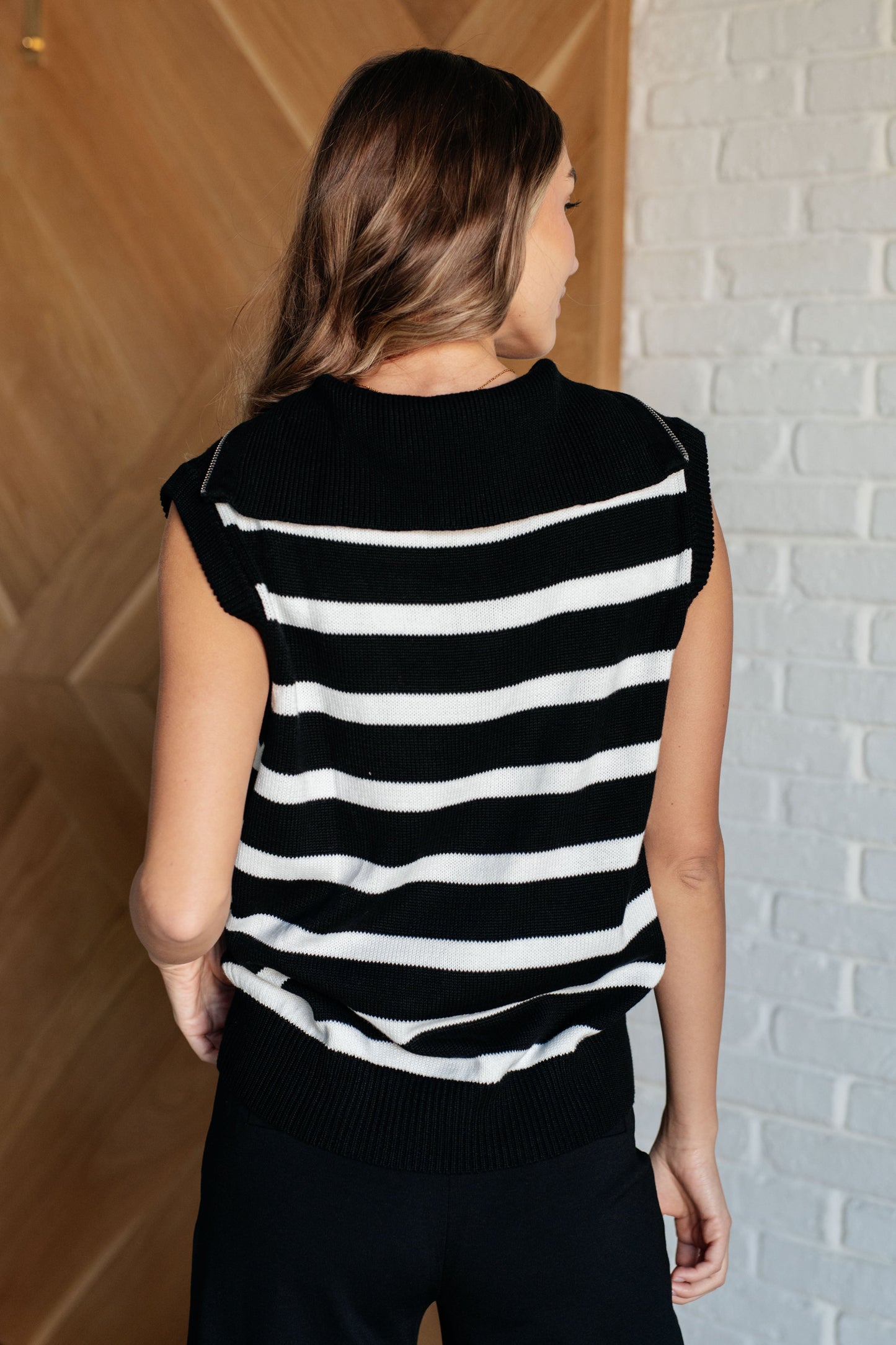 Black and White striped
Sweater Knit
Collared Neckline
Half Zip Closure
Sleeveless
Banded Ribbed Sleeve Cuff
Banded Ribbed Hemline
55% Acrylic, 45% Cotton
Sleeveless
True to Size