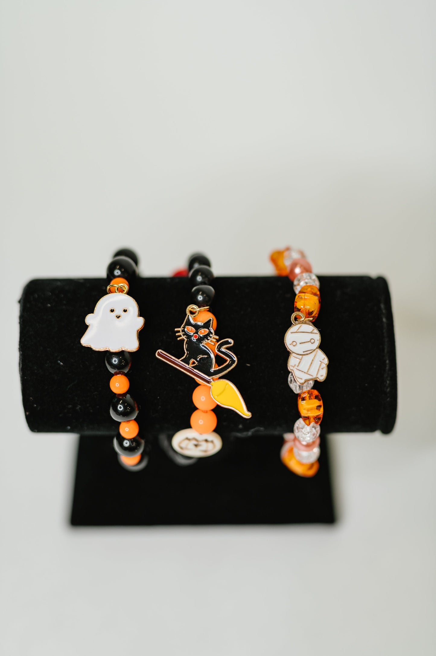 Plastic Bead stretch Halloween bracelet stack
Elastic
Gold Plated Enamel Charms
Set of 3
Ghost: 7/8” x 11/16”
Mummy: 1/2” X 7/8”
Kitty: 1 1/4” x 5/8”
