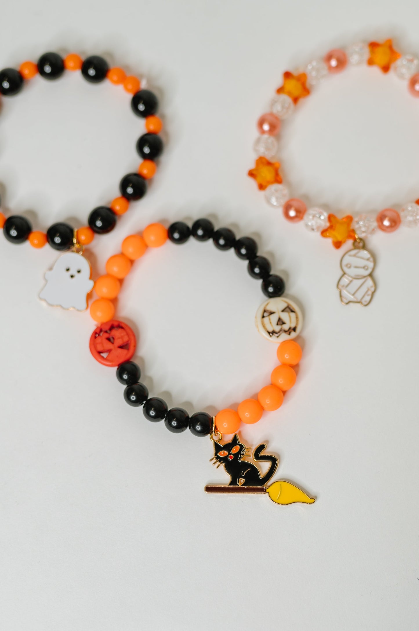 Plastic Bead stretch Halloween bracelet stack
Elastic
Gold Plated Enamel Charms
Set of 3
Ghost: 7/8” x 11/16”
Mummy: 1/2” X 7/8”
Kitty: 1 1/4” x 5/8”