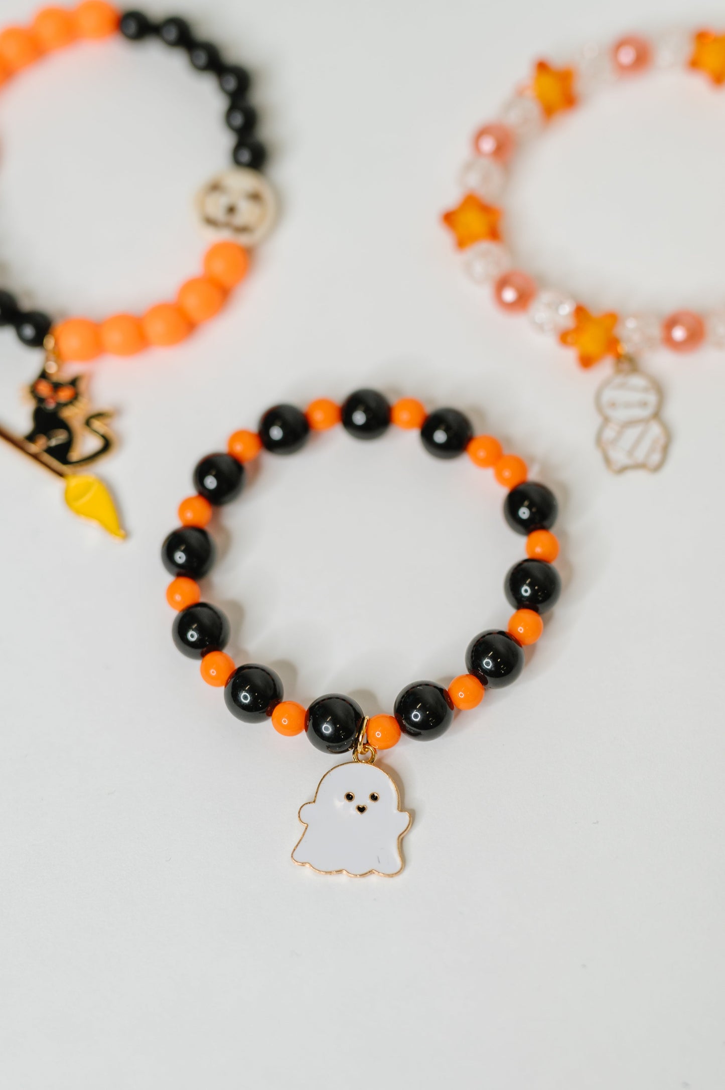 Plastic Bead stretch Halloween bracelet stack
Elastic
Gold Plated Enamel Charms
Set of 3
Ghost: 7/8” x 11/16”
Mummy: 1/2” X 7/8”
Kitty: 1 1/4” x 5/8”
