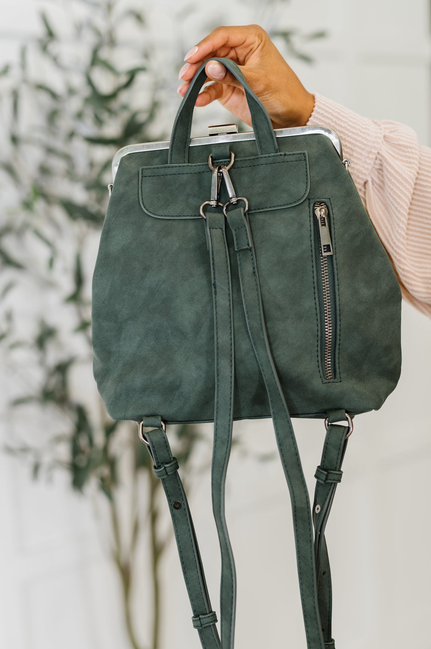 Backpack in Charcoal
10.5″ Tall
9″ Wide
4″ Deep
Brass Plated Clasp Closure At Top
22" Adjustable and Removable Crossbody Strap
16" Adjustable and Removable Backpack Strap
Vertical Zipper Closure In Back
Zipper Closure Pocket Inside
Floral Printed Lining
100% Vegan Leather