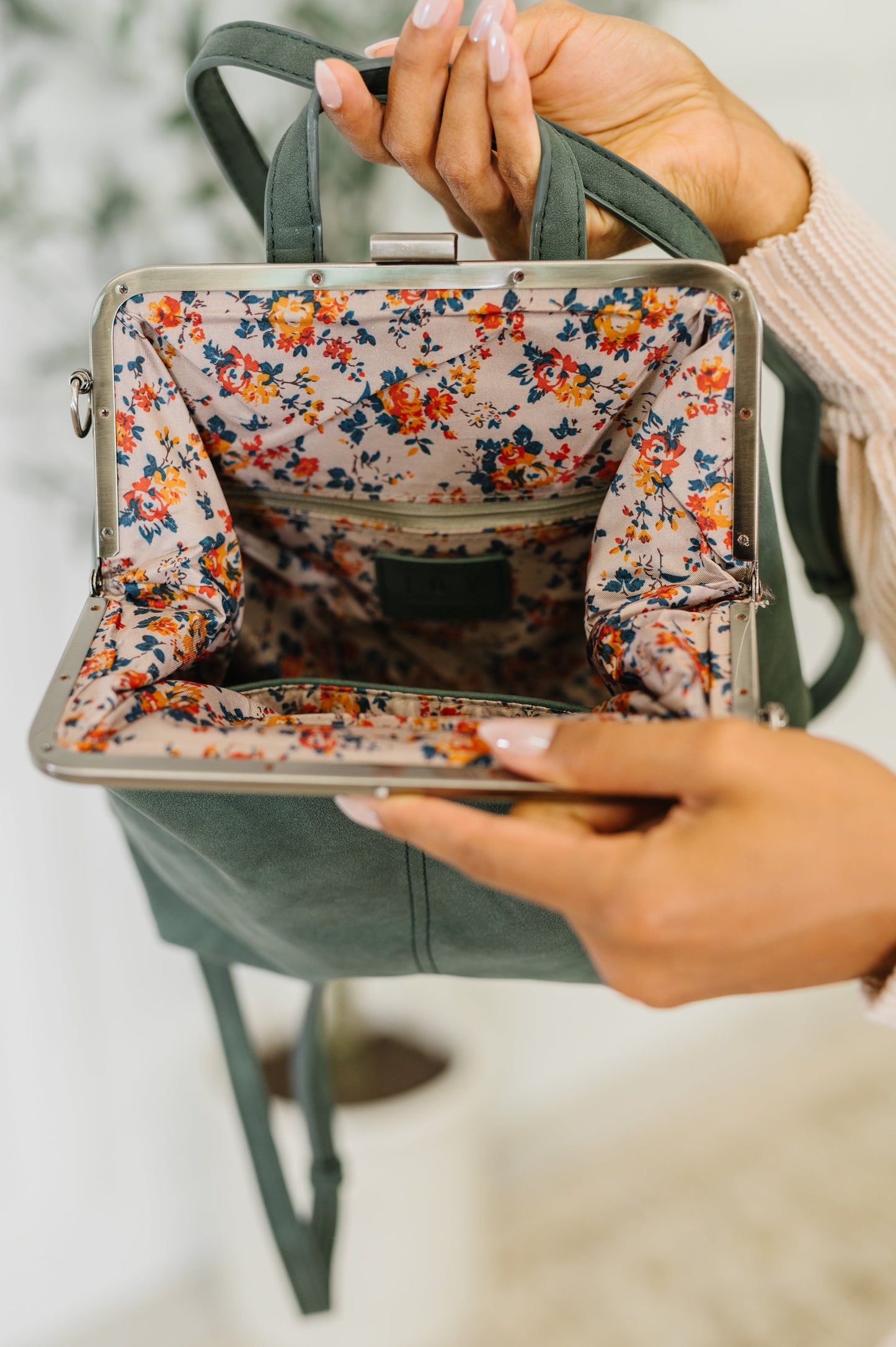Backpack in Peacock
10.5″ Tall
9″ Wide
4″ Deep
Brass Plated Clasp Closure At Top
22" Adjustable and Removable Crossbody Strap
16" Adjustable and Removable Backpack Strap
Vertical Zipper Closure In Back
Zipper Closure Pocket Inside
Floral Printed Lining
100% Vegan Leather