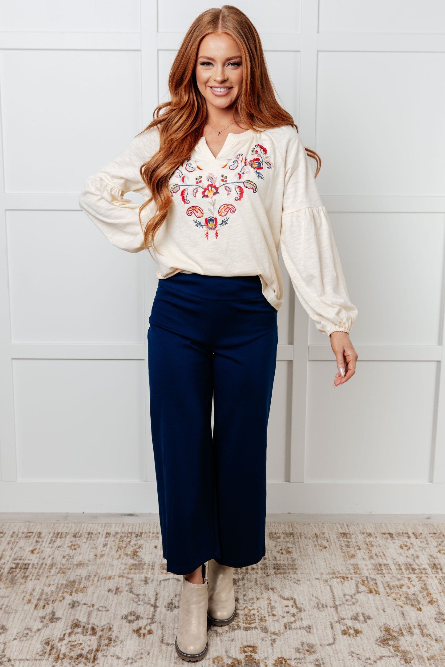 Long sleeve embroidered blouse
Lightweight Jersey Knit
Notched V-Neckline
Bishop Sleeve
Cased Elastic Sleeve Cuff
Lined Front Bodice
Scooped Hem
Machine Embroidered Details
65% Polyester, 35% Cotton
True to Size