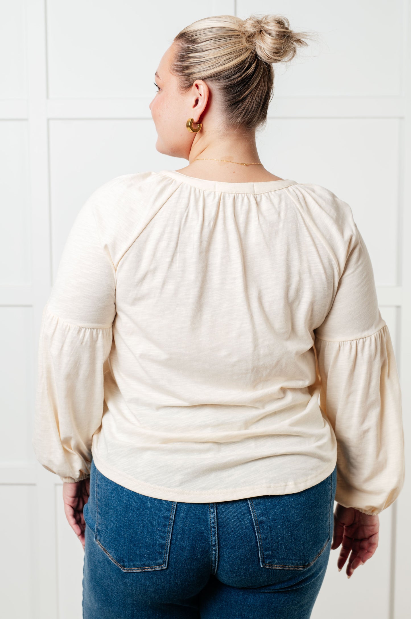 Long sleeve embroidered blouse
Lightweight Jersey Knit
Notched V-Neckline
Bishop Sleeve
Cased Elastic Sleeve Cuff
Lined Front Bodice
Scooped Hem
Machine Embroidered Details
65% Polyester, 35% Cotton
True to Size