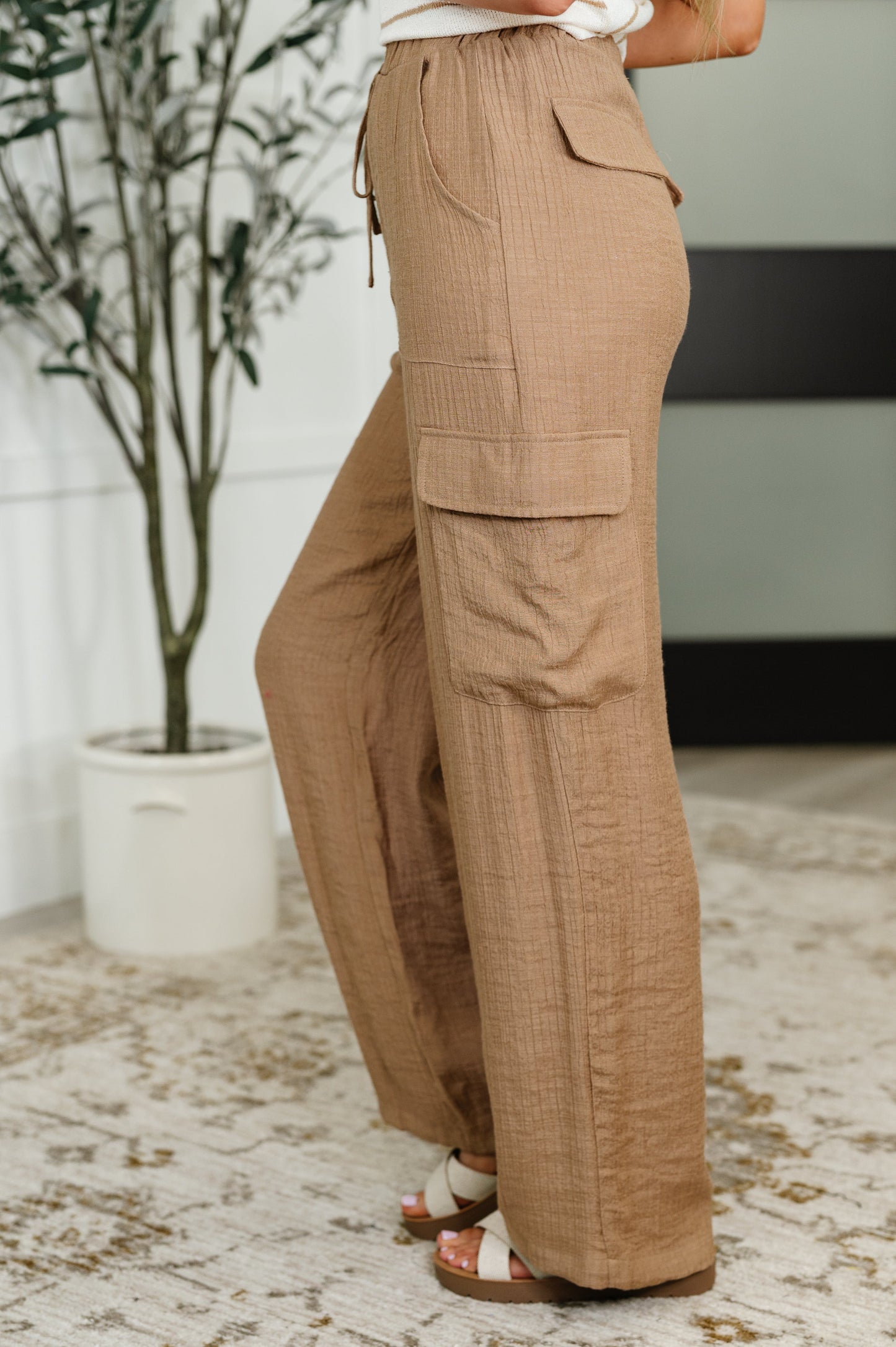 Tan cargo pants with a drawstring by Blu Pepper