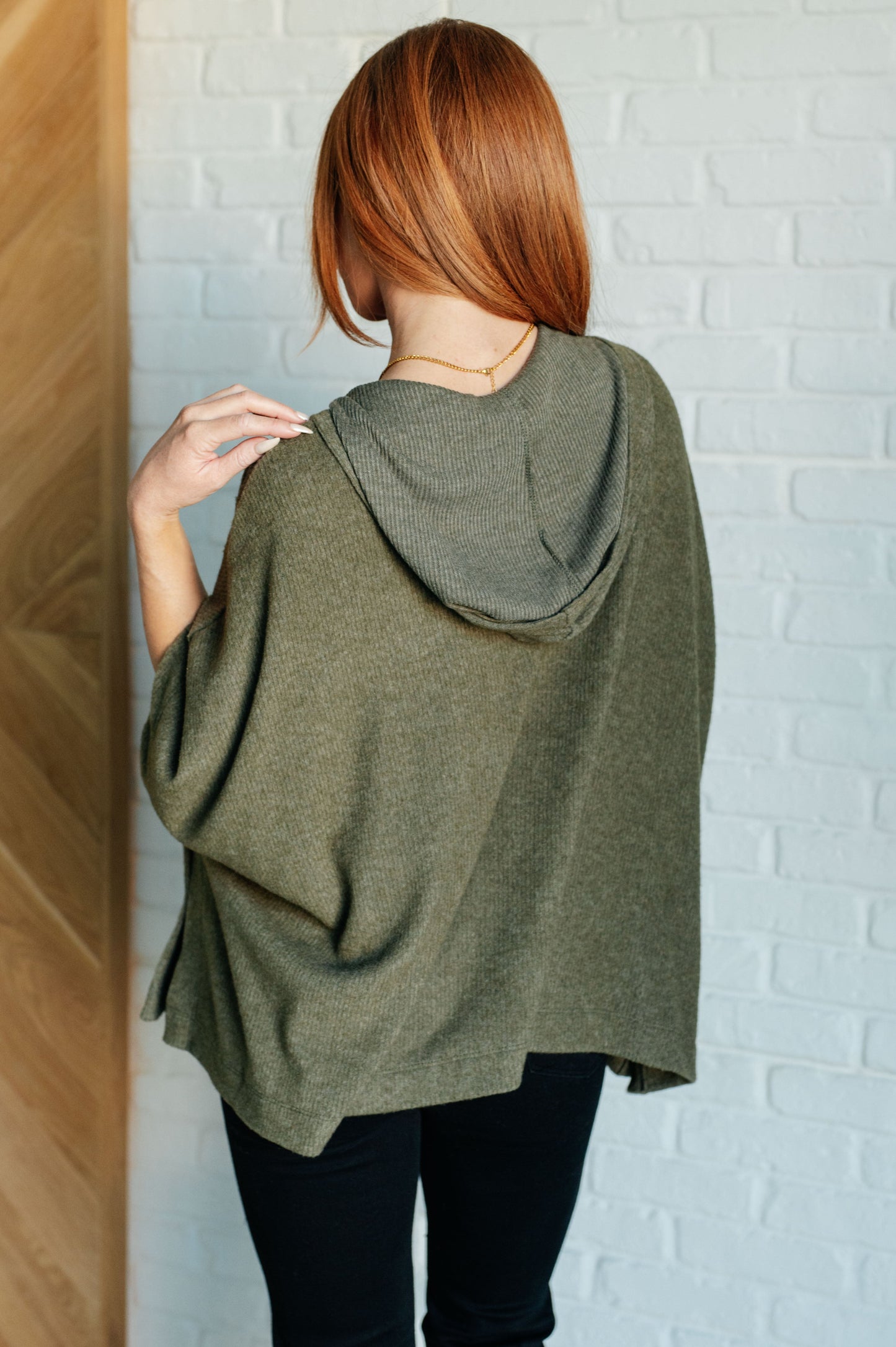 Olive Ribbed Jersey Knit Hooded Poncho by White Birch
Hooded V-Neckline
Poncho Style
Tacked Sides
Kangaroo Pocket
78% Polyester, 18% Rayon, 4% Spandex
True to Size, Oversized Fit