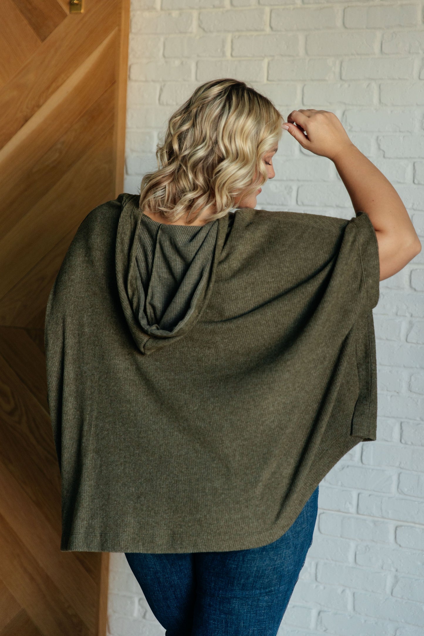Olive Ribbed Jersey Knit Hooded Poncho by White Birch
Hooded V-Neckline
Poncho Style
Tacked Sides
Kangaroo Pocket
78% Polyester, 18% Rayon, 4% Spandex
True to Size, Oversized Fit