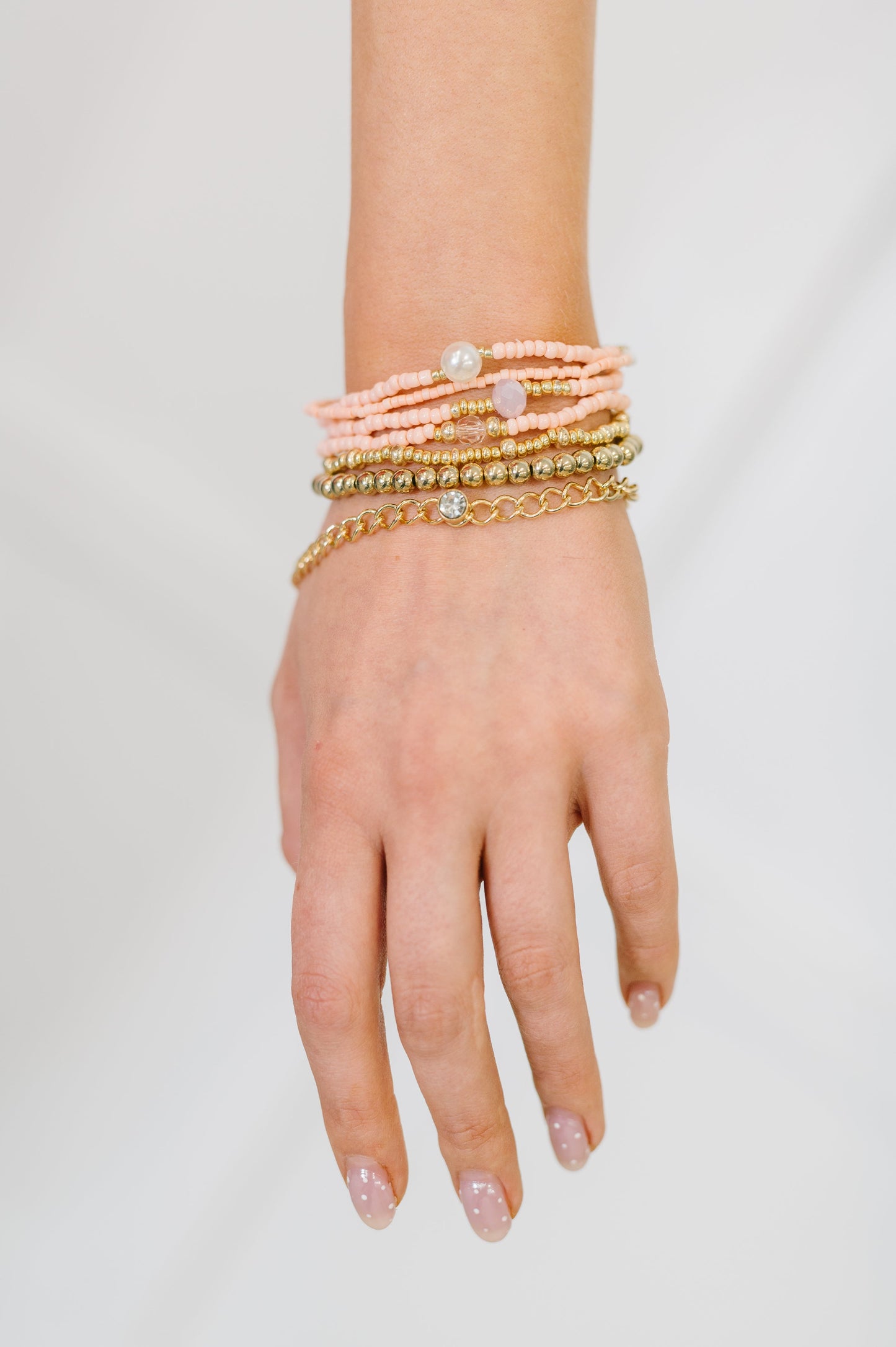 Set of 7 bracelet set in Pink and Gold
Elastic
Beaded
One Chain
Pearl and Gem Details
Pink and Gold