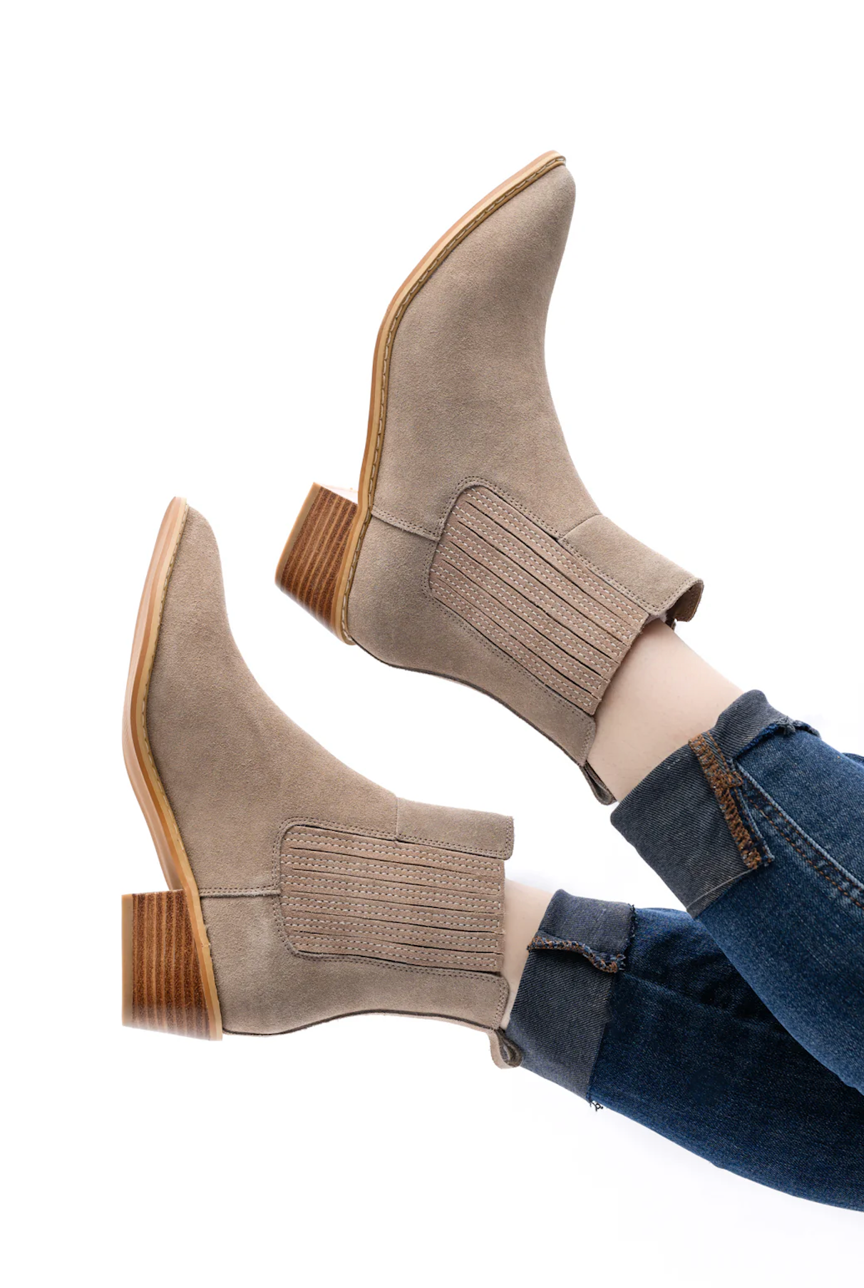 Taupe genuine suede pull on booties by Naughty Monkey.