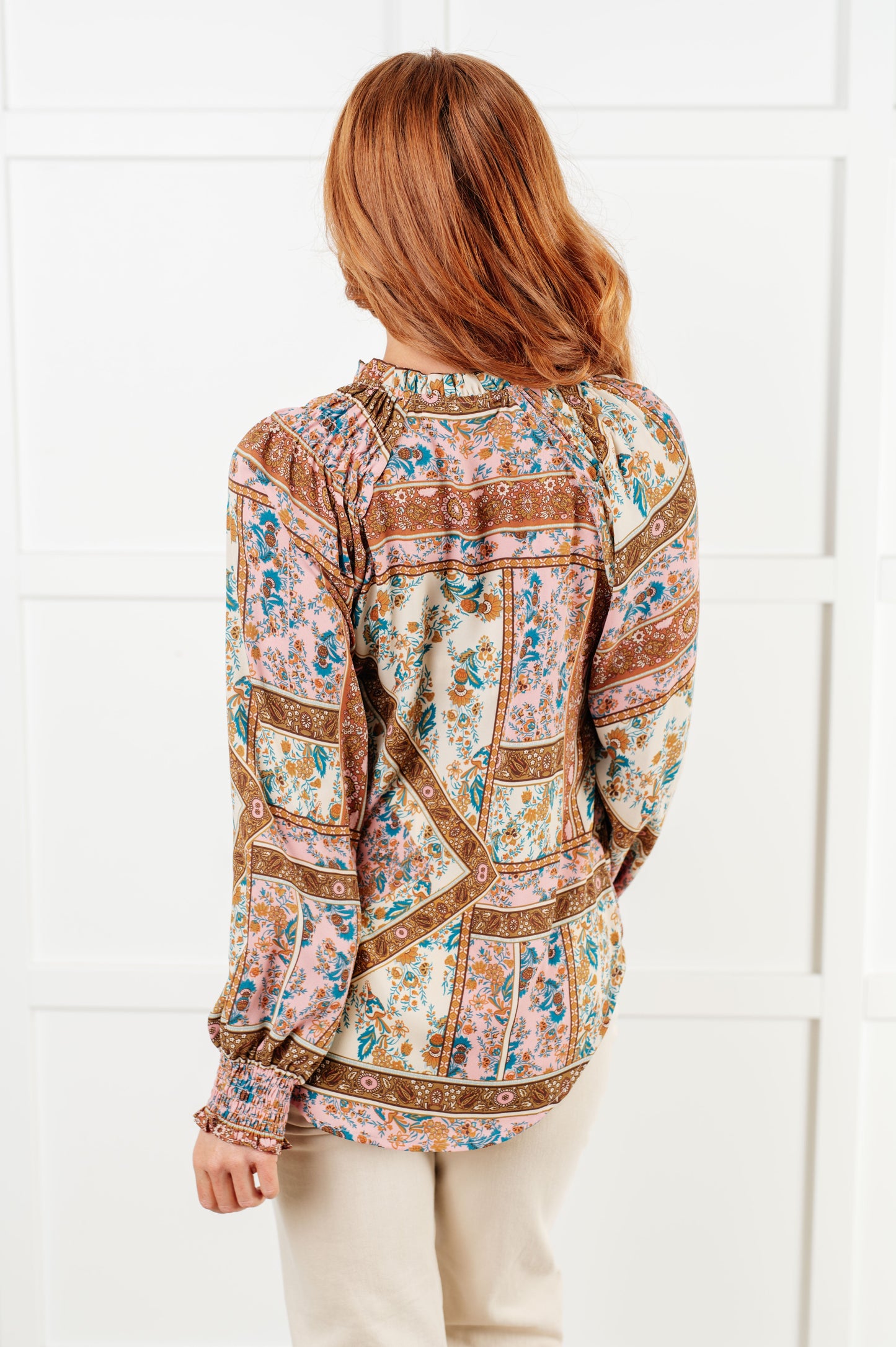 Long sleeve mixed print peasant blouse
Woven
V-Neck
Functional Neck Tie
Front Button Closures
Raglan Balloon Sleeve
Smocked Elastic Sleeve Cuffs
Scooped High-Low Hem
100% Polyester
True to Size