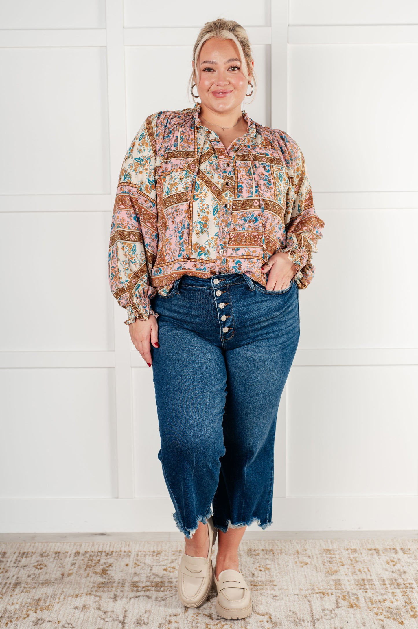 Long sleeve mixed print peasant blouse
Woven
V-Neck
Functional Neck Tie
Front Button Closures
Raglan Balloon Sleeve
Smocked Elastic Sleeve Cuffs
Scooped High-Low Hem
100% Polyester
True to Size