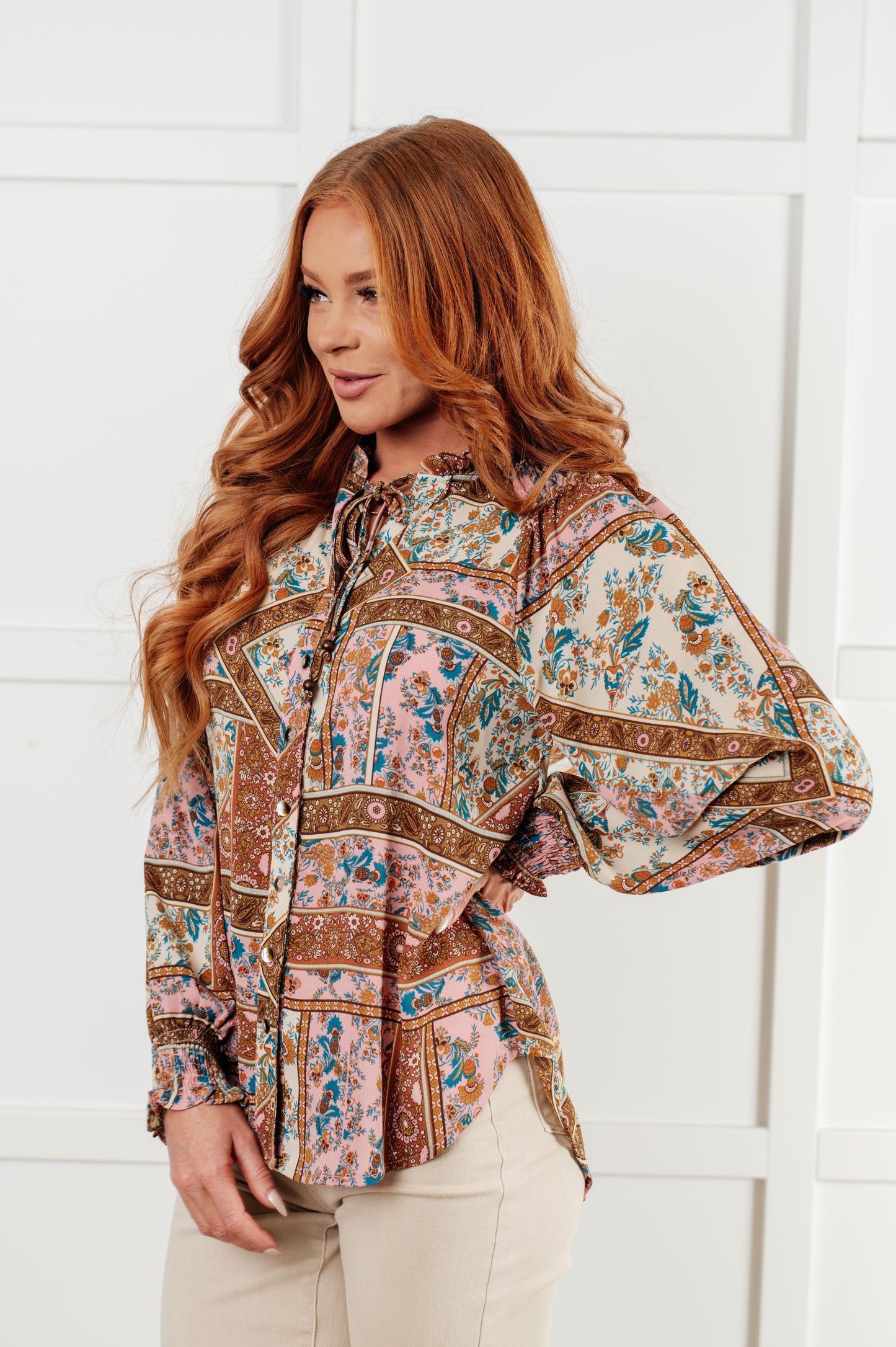 Long sleeve mixed print peasant blouse
Woven
V-Neck
Functional Neck Tie
Front Button Closures
Raglan Balloon Sleeve
Smocked Elastic Sleeve Cuffs
Scooped High-Low Hem
100% Polyester
True to Size