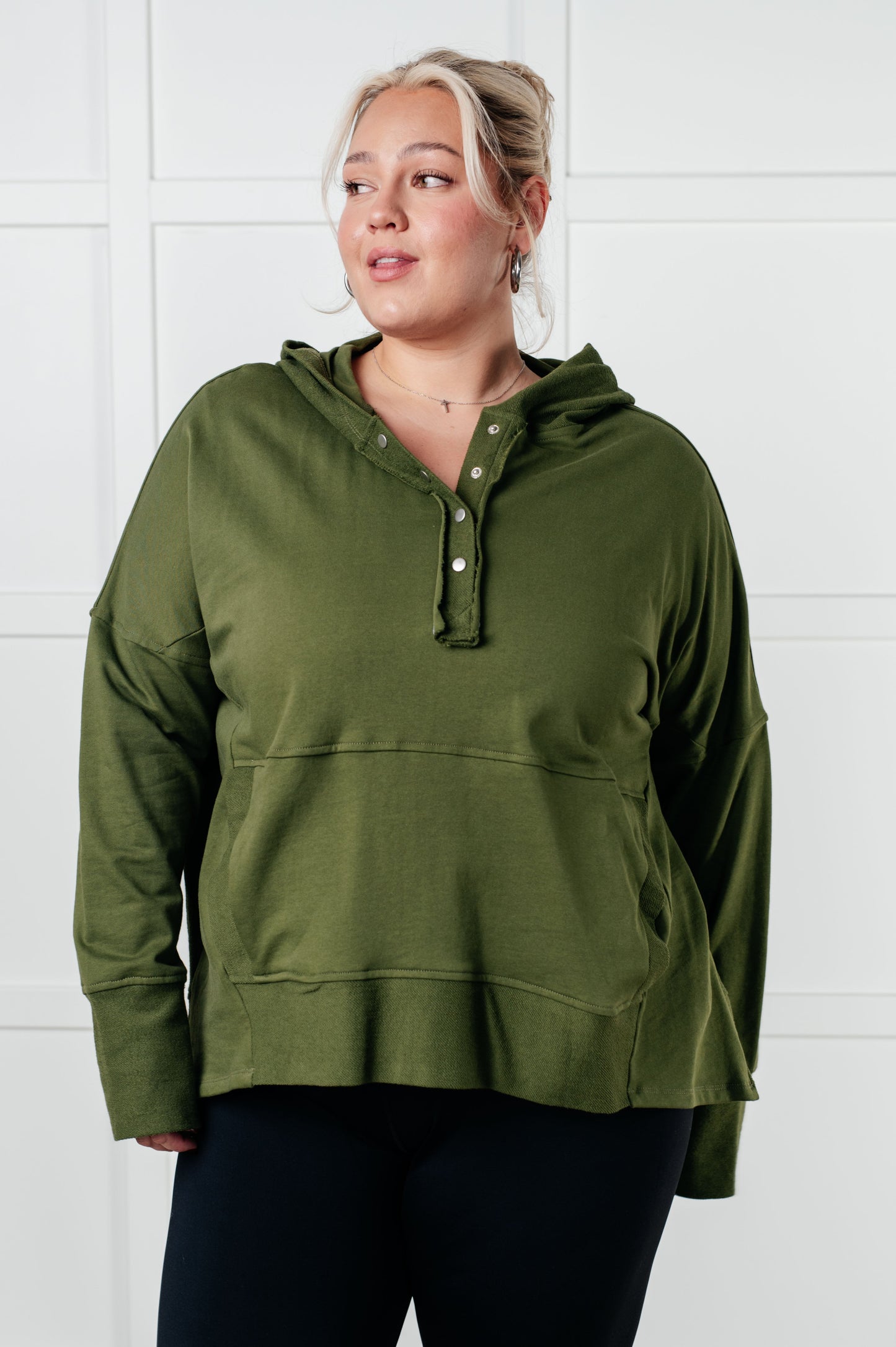 Long sleeve Dark Olive French Terry top by Haptics
Hooded Neckline
Half Front Snap Button Closures
Drop Shoulder
Exaggerated Sleeve Cuff
Faux Kangaroo Pocket
Functional Side Pockets
Contrast Details
100% Cotton
True to Size