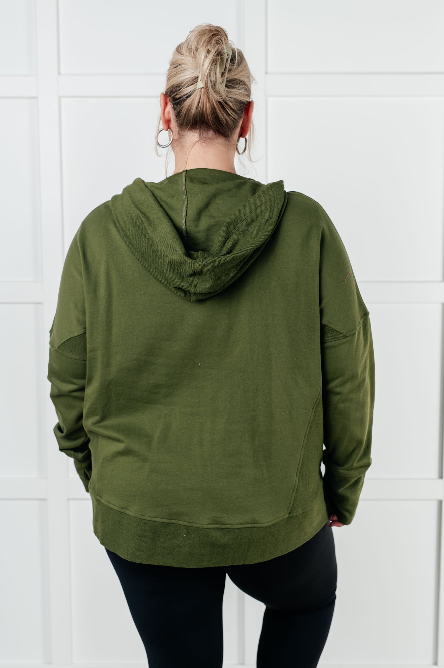 Long sleeve Dark Olive French Terry top by Haptics
Hooded Neckline
Half Front Snap Button Closures
Drop Shoulder
Exaggerated Sleeve Cuff
Faux Kangaroo Pocket
Functional Side Pockets
Contrast Details
100% Cotton
True to Size
