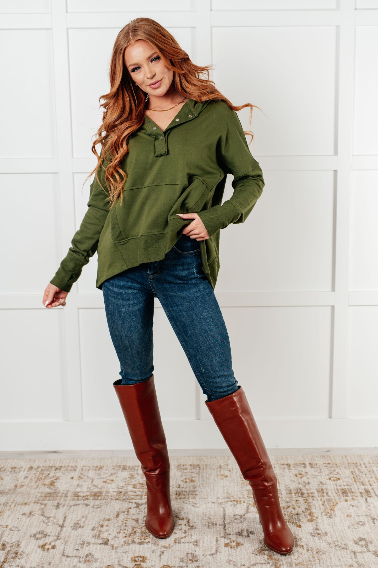 Long sleeve Dark Olive French Terry top by Haptics
Hooded Neckline
Half Front Snap Button Closures
Drop Shoulder
Exaggerated Sleeve Cuff
Faux Kangaroo Pocket
Functional Side Pockets
Contrast Details
100% Cotton
True to Size