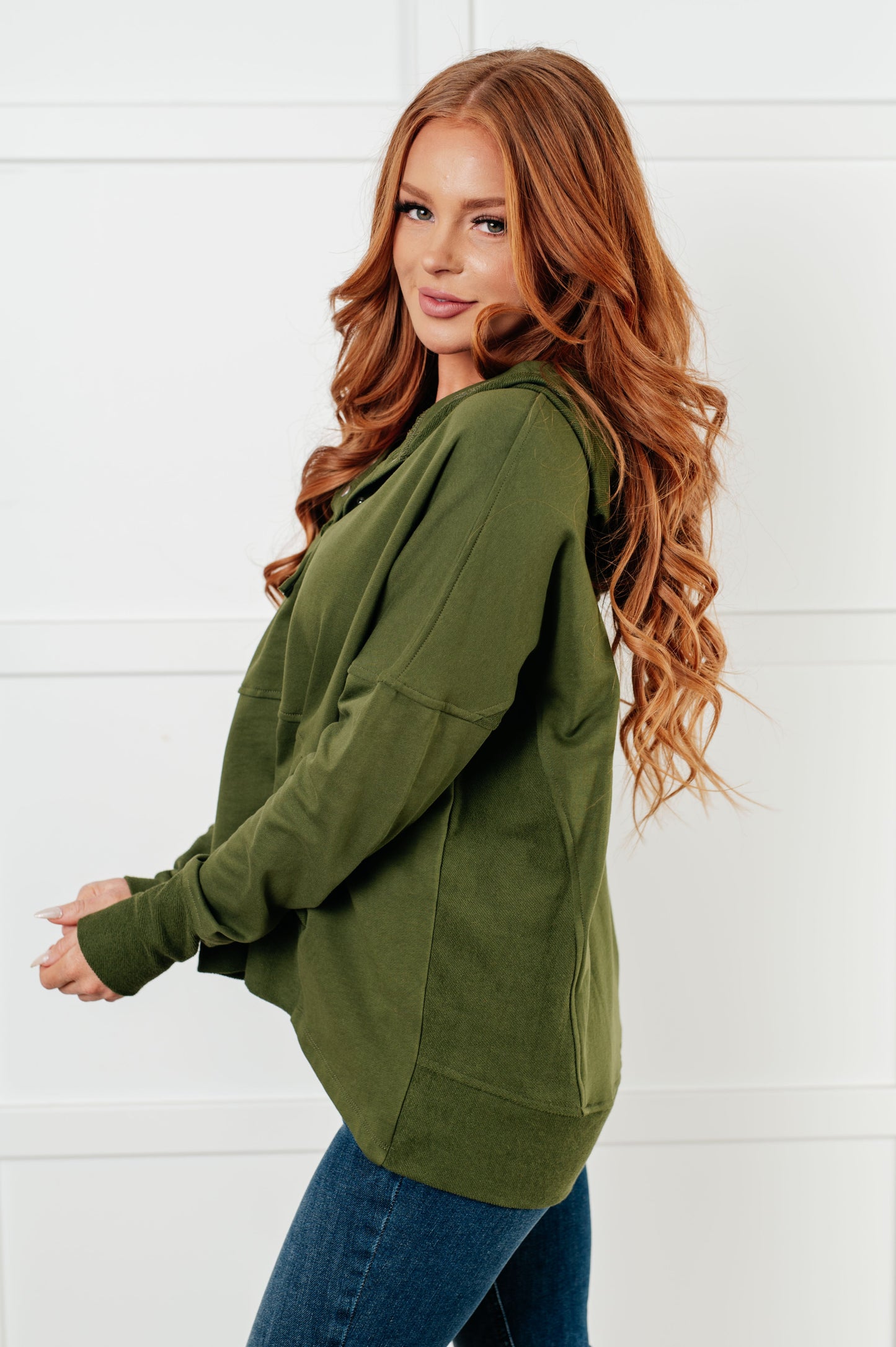 Long sleeve Dark Olive French Terry top by Haptics
Hooded Neckline
Half Front Snap Button Closures
Drop Shoulder
Exaggerated Sleeve Cuff
Faux Kangaroo Pocket
Functional Side Pockets
Contrast Details
100% Cotton
True to Size