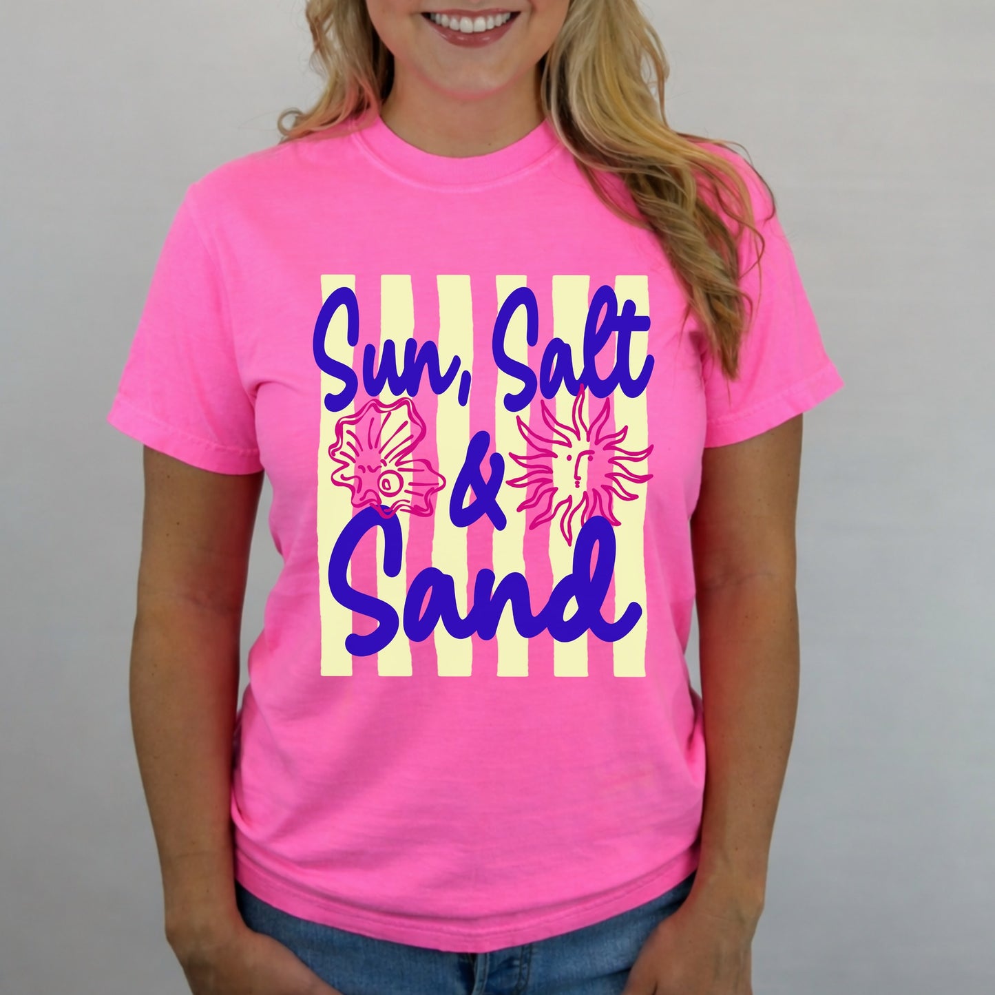 Neon pink Comfort Colors t-shirt with Sun Salt and Sand graphic featuring seashell and sun design for summer beach style