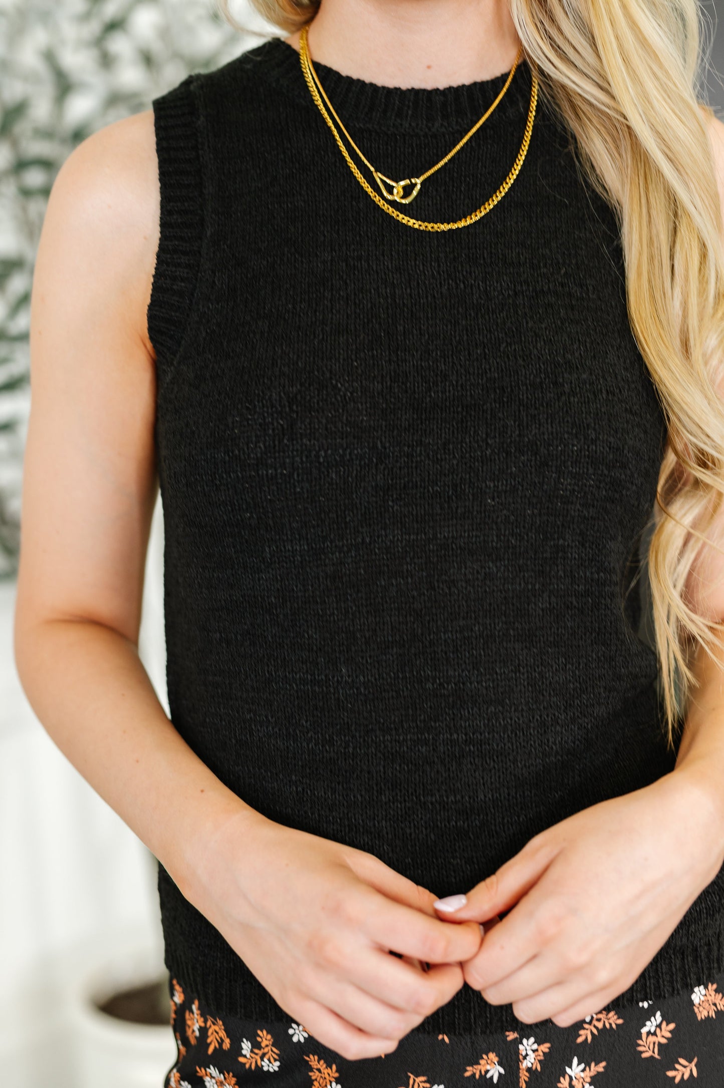 Black sleeveless top by Blu Pepper