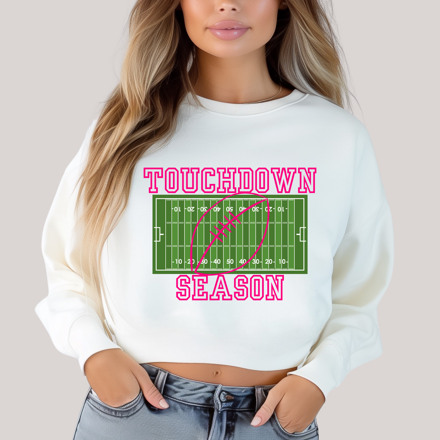 White sweatshirt with 'Touchdown Season' graphic design.