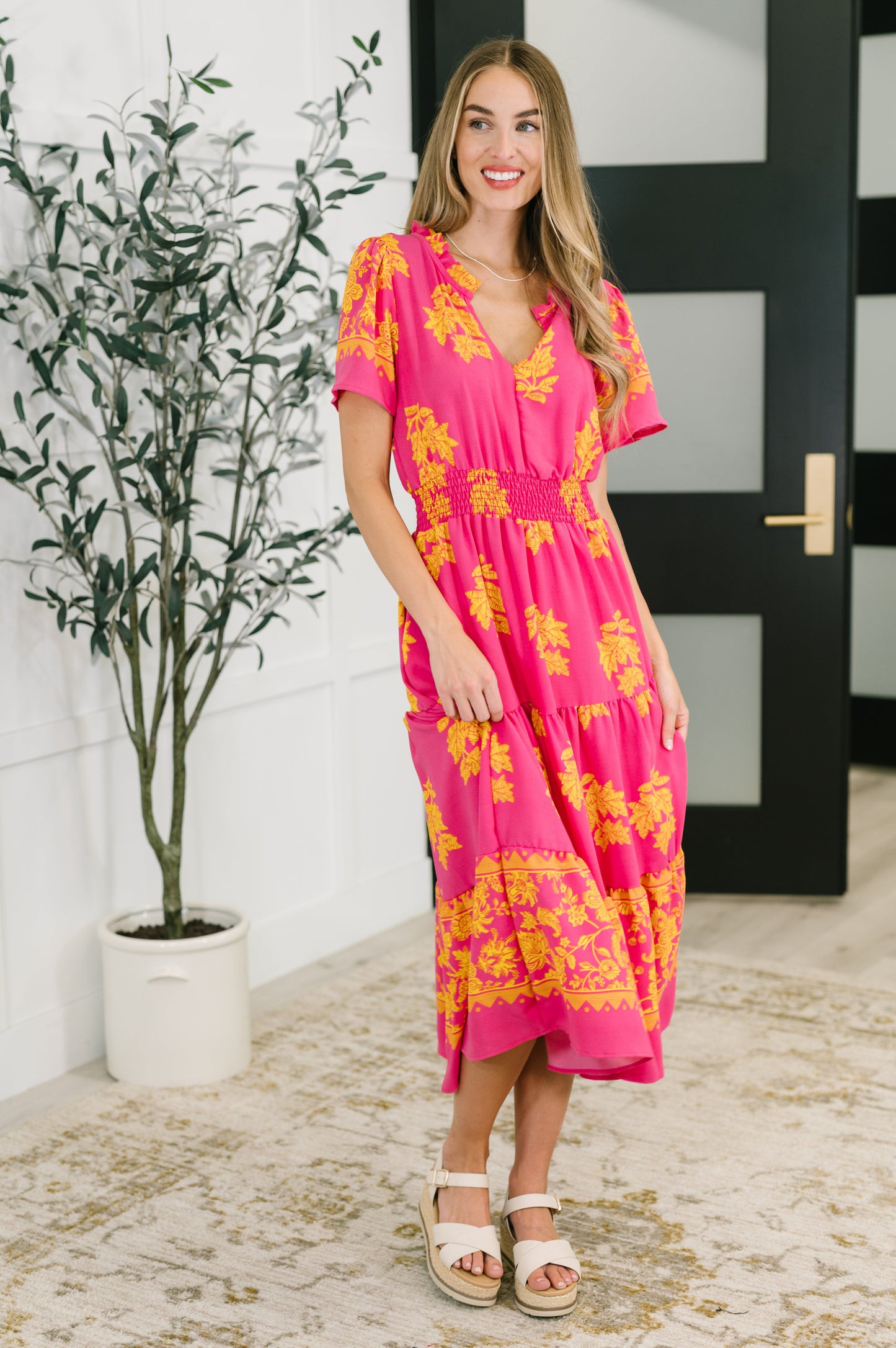 Pink floral, short sleeve dress by Haptics
Lightweight Woven
No Stretch
V-Neckline
Flutter Sleeve
Smocked Elastic Waistband
Functional Side Pockets
Ruffle Details
Gathered Tiers
100% Polyester
True to Size