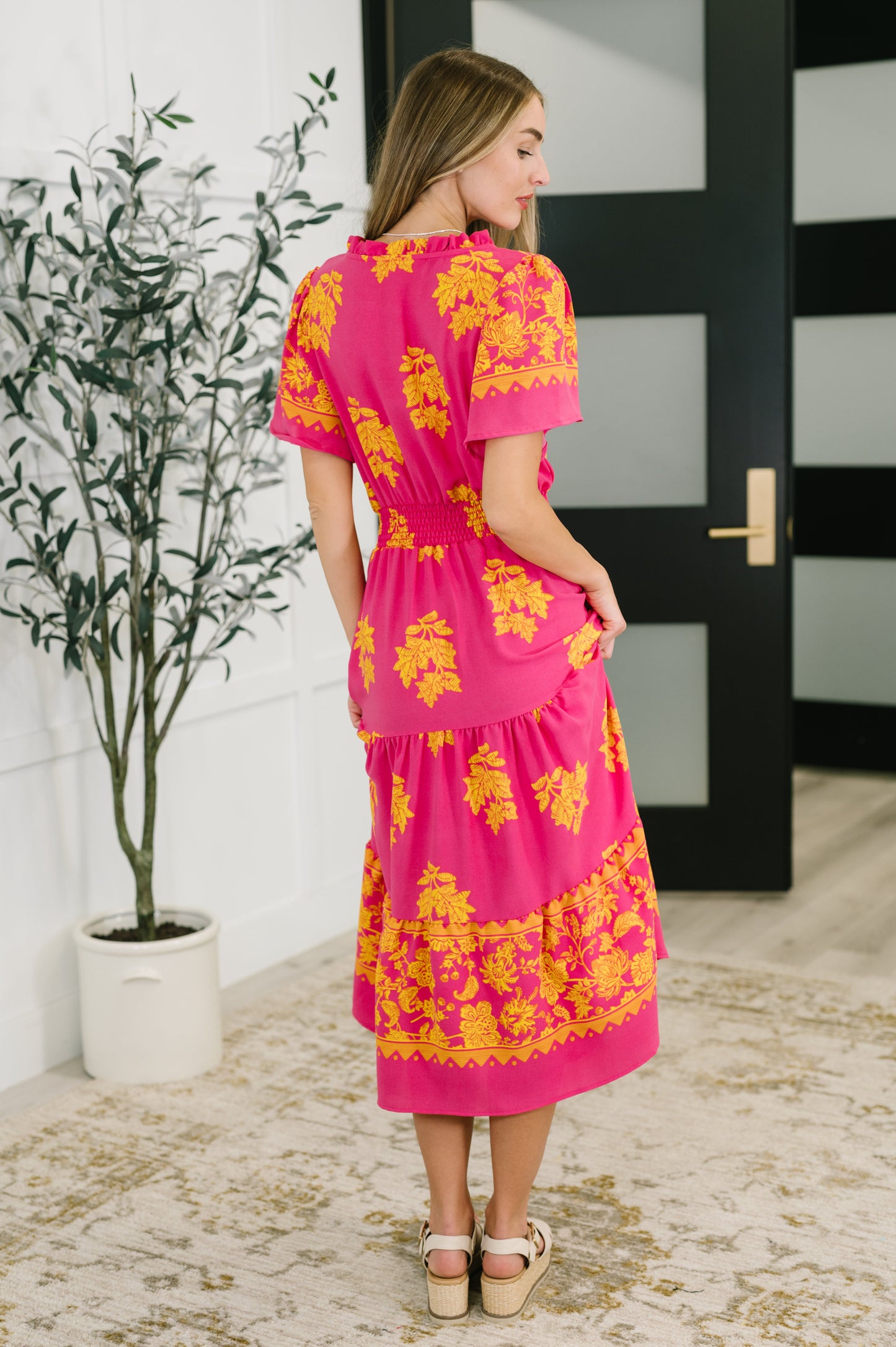 Pink floral, short sleeve dress by Haptics
Lightweight Woven
No Stretch
V-Neckline
Flutter Sleeve
Smocked Elastic Waistband
Functional Side Pockets
Ruffle Details
Gathered Tiers
100% Polyester
True to Size