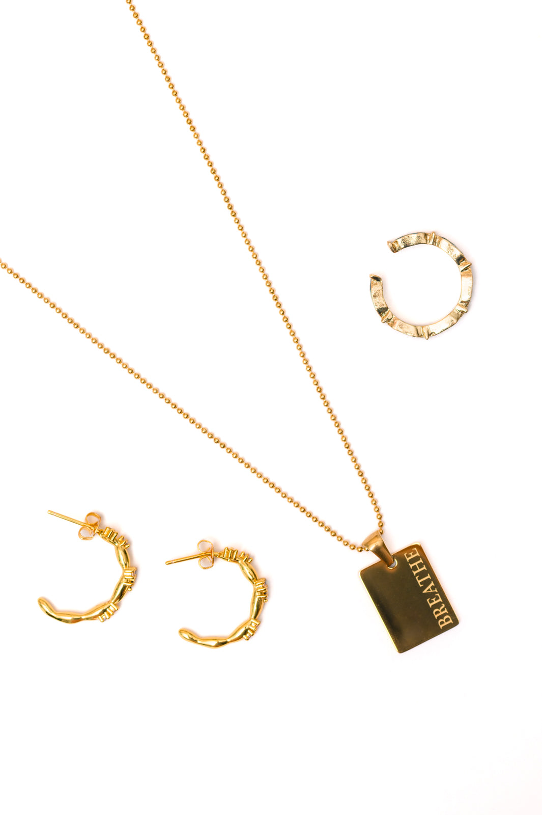 Jewelry Bundle
Mariana Hand Crafted Blue Cross Ring
Adjustable Size Opening
Dipped 18k Gold Stainless Steel
Hypoallergenic
Water Resistant
Breathe Pendent Necklace
Ball Chain
Lobster Clasp
Hypoallergenic
Lead and Nickel Compliant
16” with 2” Extender
Santana Studded Hoop Earrings
Post Half Circle Hoops
Hypoallergenic
Lead and Nickel Compliant
Gemstones may slightly vary in tone due to their natural origin