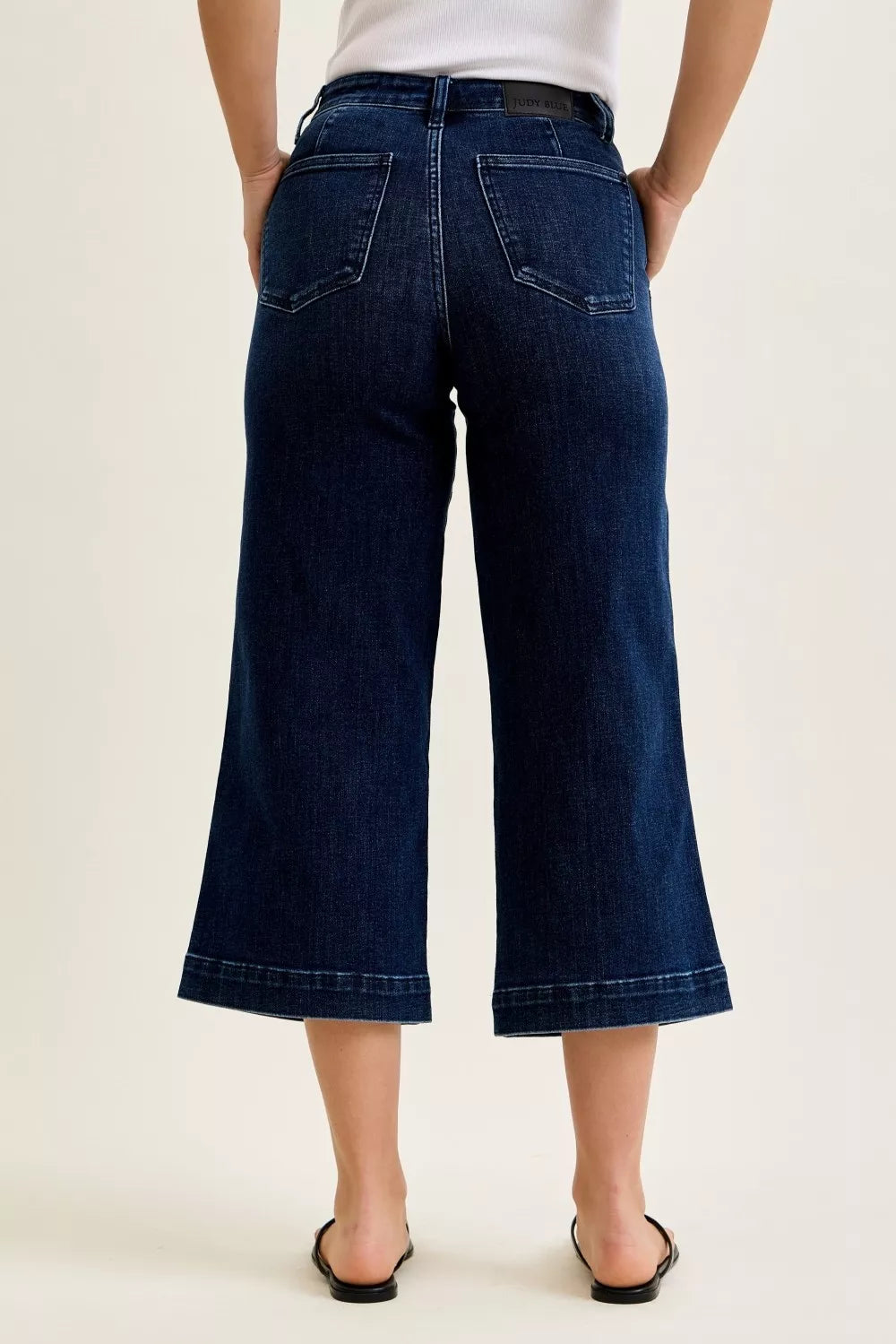 Back view of Judy Blue wide leg crop jeans highlighting pocket detail and high rise fit