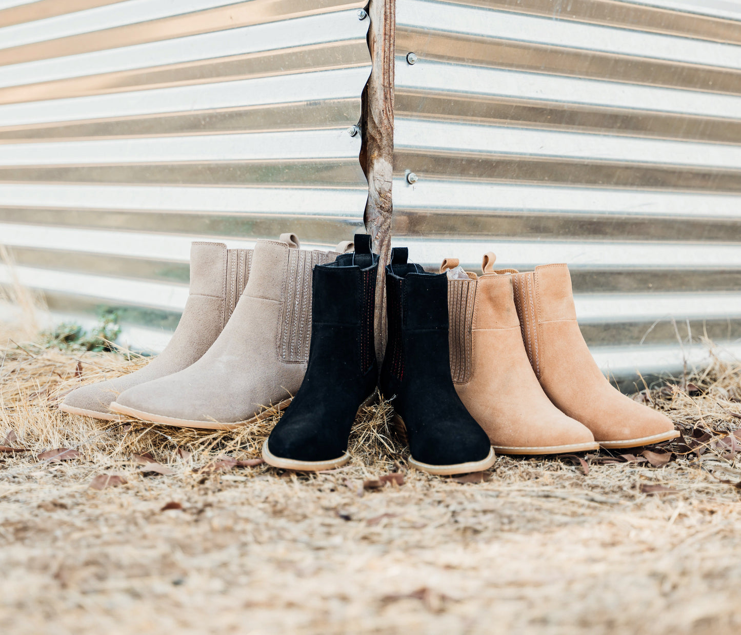 Taupe genuine suede pull on booties by Naughty Monkey.