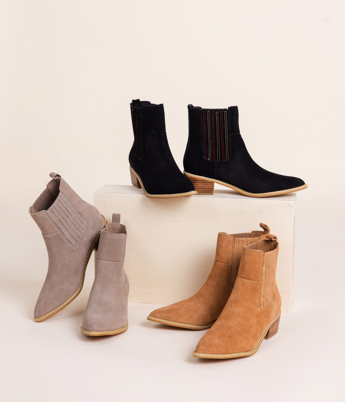 Taupe genuine suede pull on booties by Naughty Monkey.