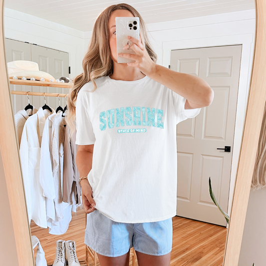 Sunshine State of Mind graphic tee
Gildan tee
Multicolor DTF printing on crewneck
True to size for a relaxed unisex fit