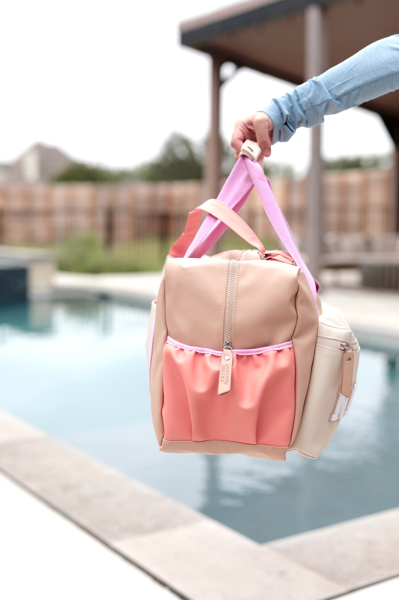 Custom name duffle bag with pastel handles and zippered pocket, perfect for travel, gym, or weekend trips