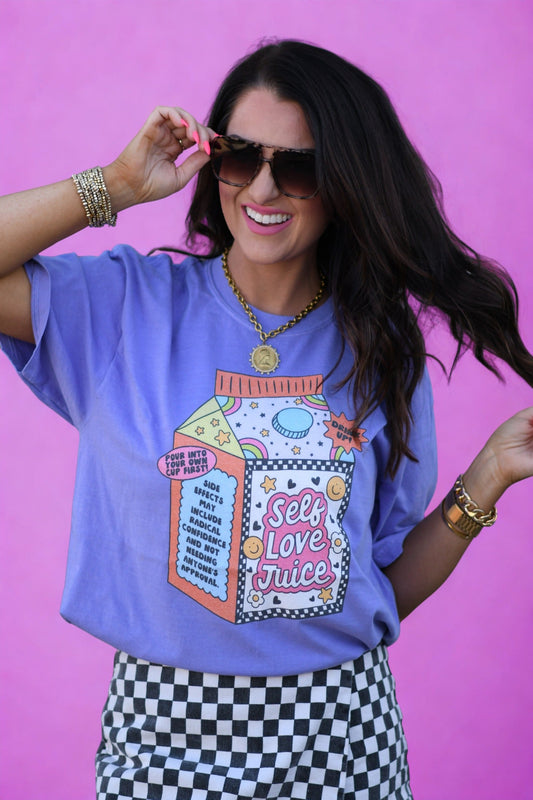Self Love Juice graphic tee in violet Comfort Colors shirt with colorful self love juice carton design worn by woman