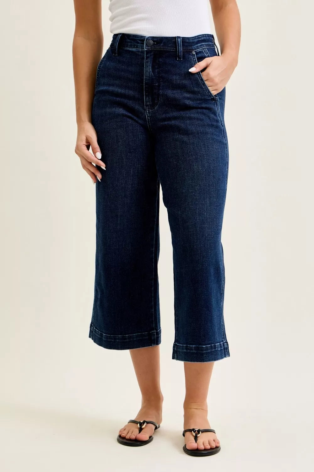 Front view of Judy Blue high waist wide leg crop jeans in dark wash denim on model outdoors