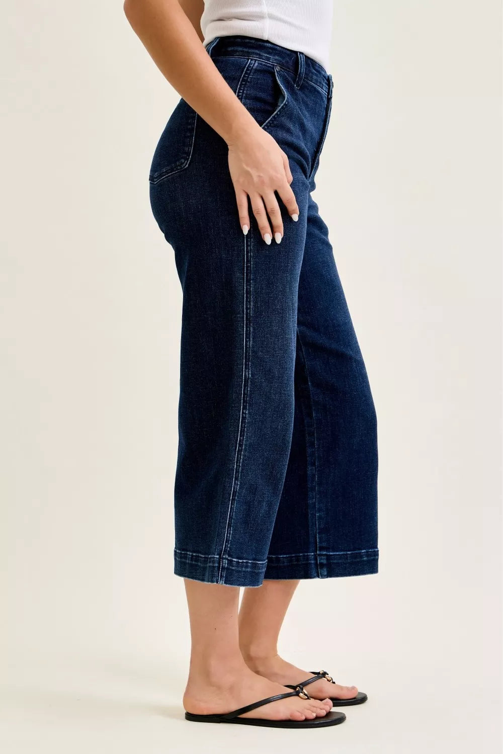 Side profile of wide leg ankle jeans showing relaxed fit and cropped length