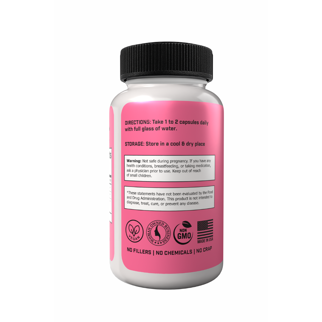 A bottle of 'No Crap In It' Womanhood Super Vitamin Supplement with pink label, black cap, and text indicating optimized hormonal balance, increased energy, and enhanced mood and relaxation.