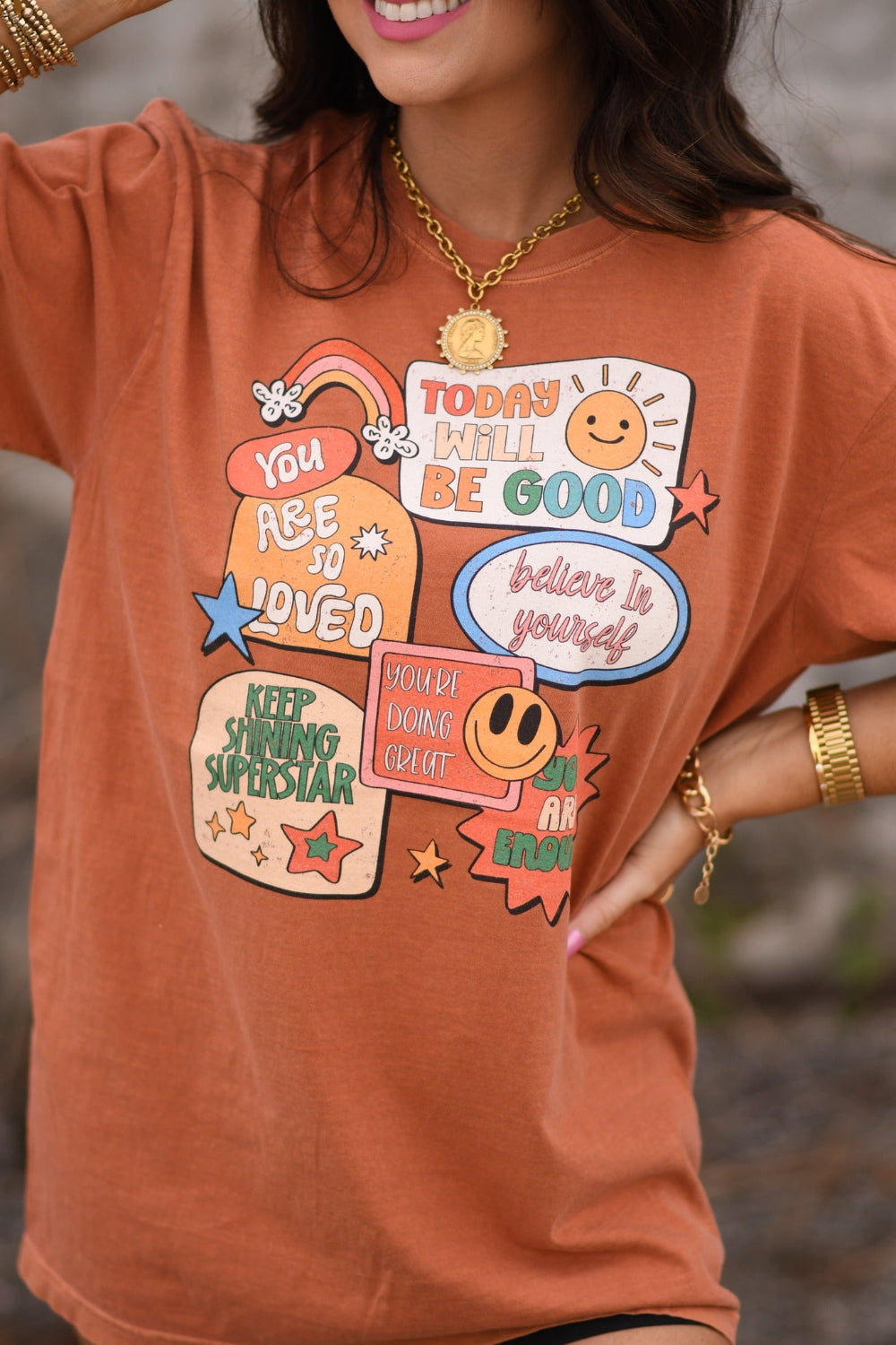 Affirmation stickers graphic tee on Comfort Colors yam shirt featuring positive messages like believe in yourself and today will be good retro motivational design