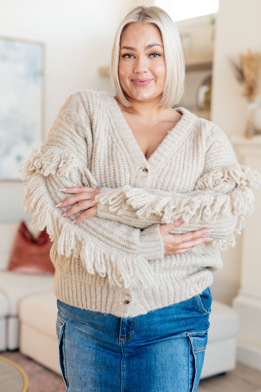 Beige long sleeve Mid-Weight sweater Sweater Knit
V-Neckline
Looped Fringe
Button Front
50% Recycled Acrylic, 50% Acrylic
True to Size