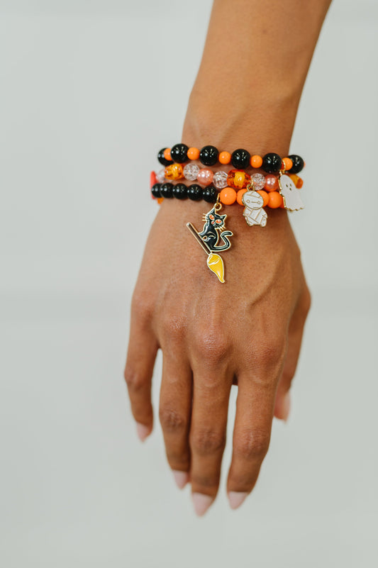 Plastic Bead stretch Halloween bracelet stack
Elastic
Gold Plated Enamel Charms
Set of 3
Ghost: 7/8” x 11/16”
Mummy: 1/2” X 7/8”
Kitty: 1 1/4” x 5/8”