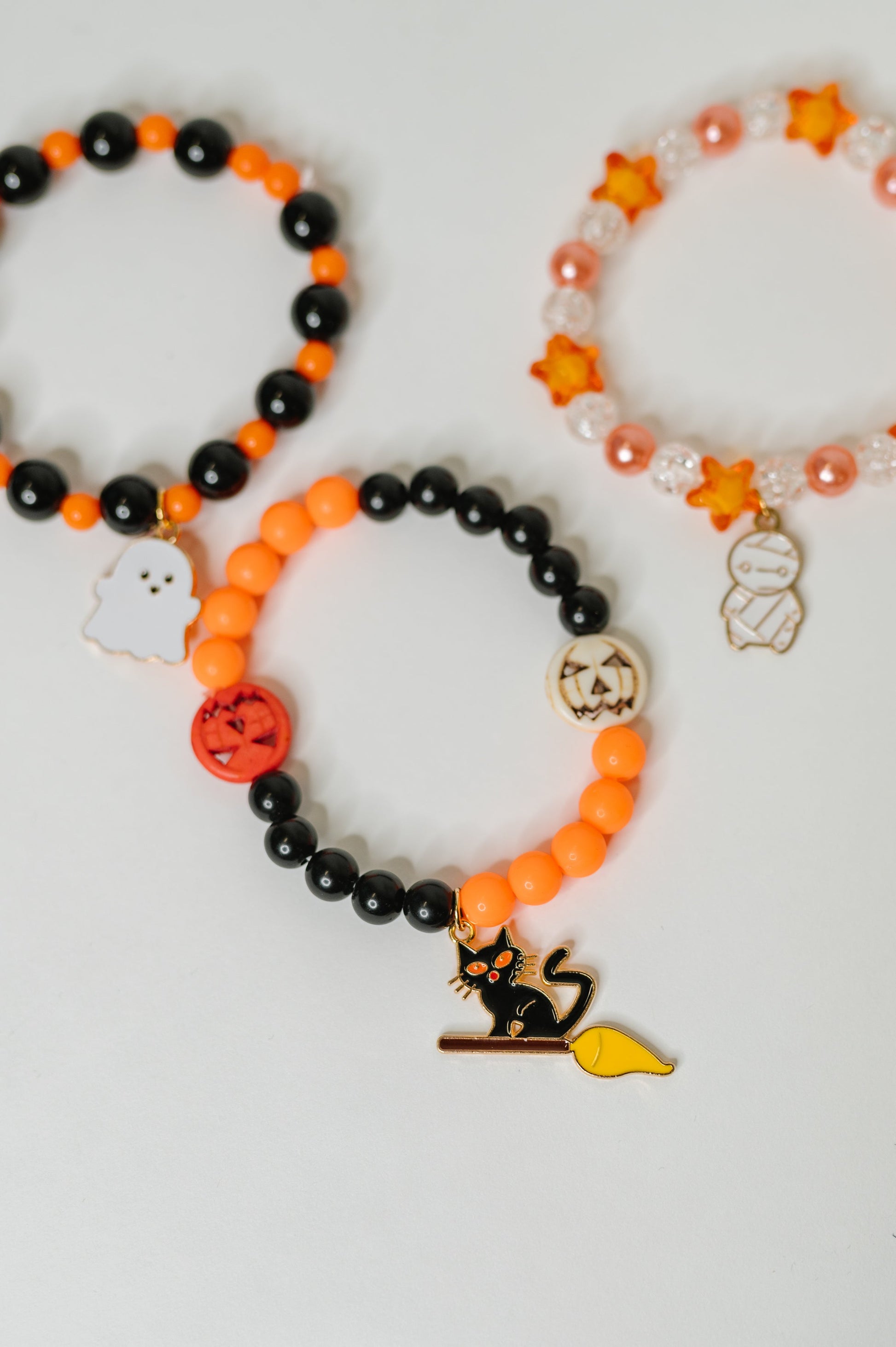Plastic Bead stretch Halloween bracelet stack
Elastic
Gold Plated Enamel Charms
Set of 3
Ghost: 7/8” x 11/16”
Mummy: 1/2” X 7/8”
Kitty: 1 1/4” x 5/8”