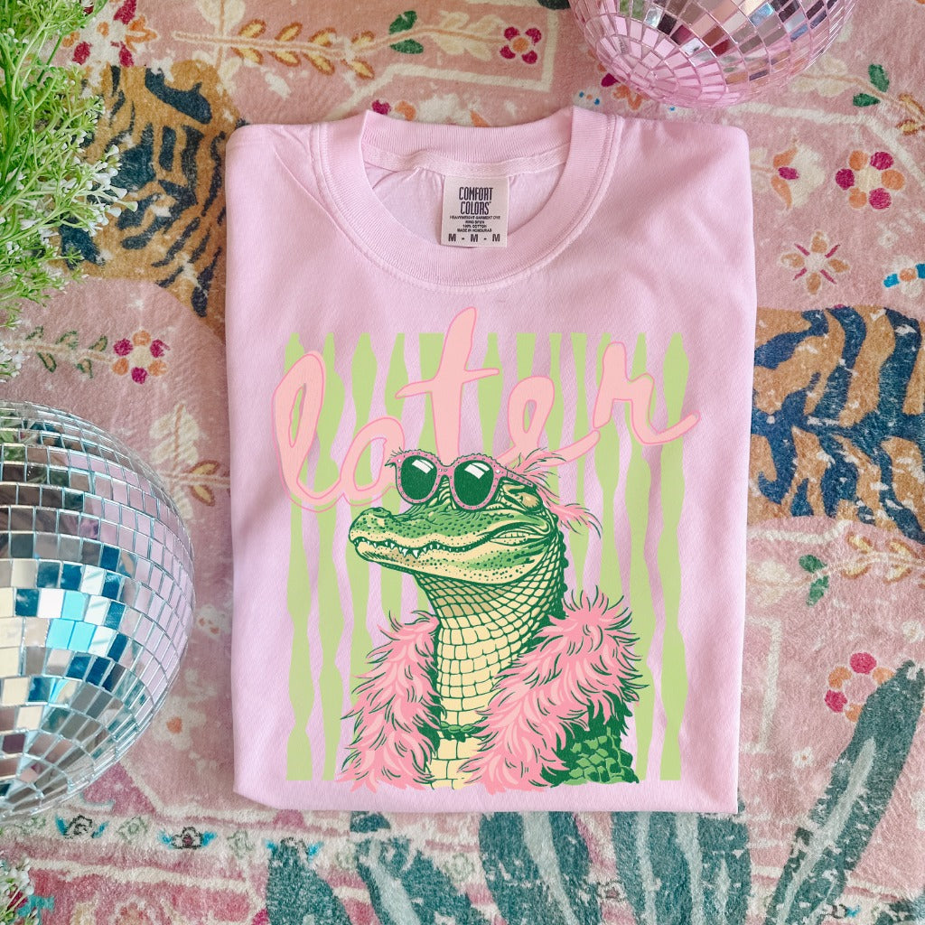 Pink Boujee Later Gator graphic t-shirt with stylish alligator wearing sunglasses and feather boa, trendy boutique tee