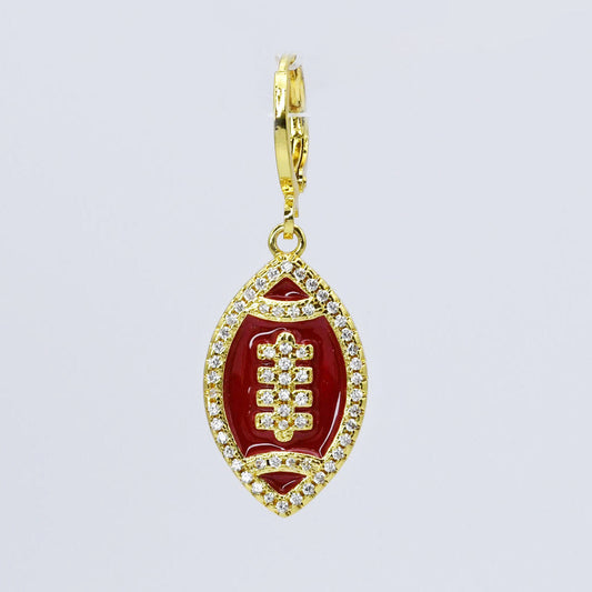 Gold and Brown football-shaped pendant with clear stones 
