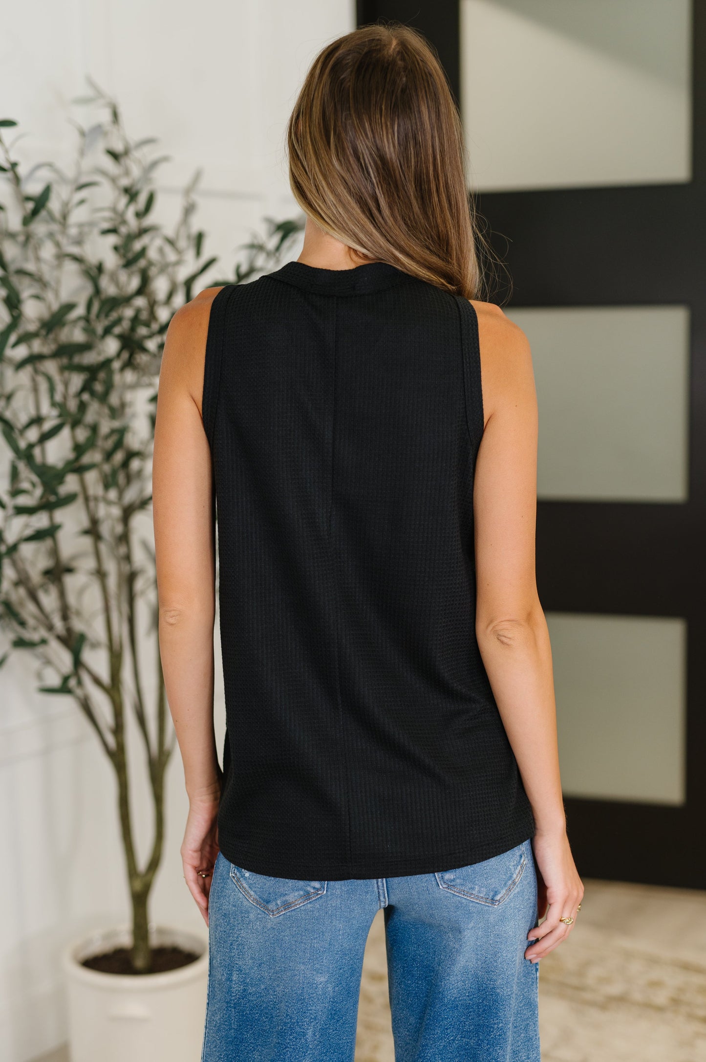 black sleeveless top with buttons by Andree by Unit