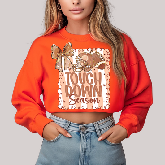 Orange sweatshirt with 'Touchdown Season' design