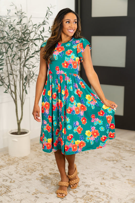 Green Floral, Light-Mid Weight Brushed Knit Midi length dress
Banded, Round Neckline
Double Layered Flutter Sleeve
Elastic Waistband
Functional Side Pockets
95% Polyester, 5% Spandex
True to Size