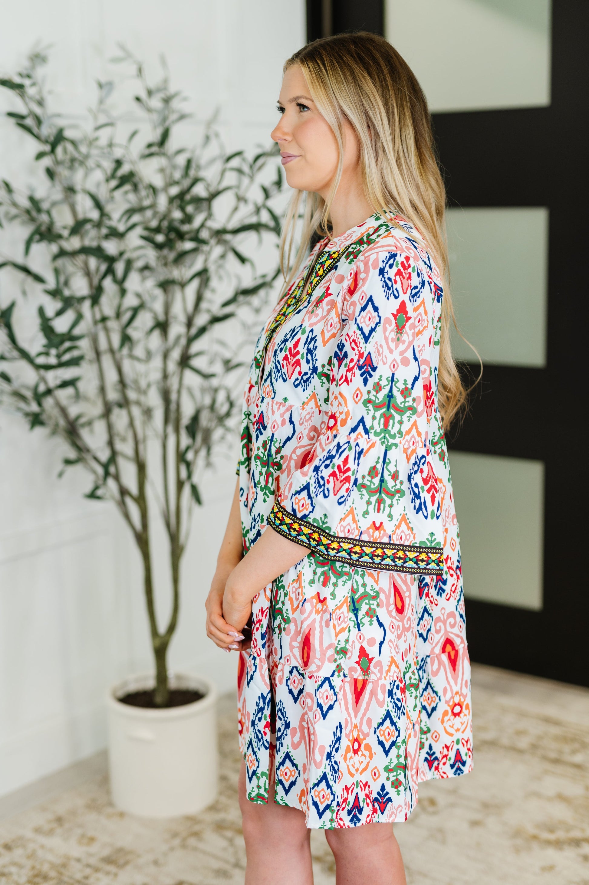 Boho Tiered Dress
Poplin Woven
No Stretch
Criss-Cross V-Neckline
Bell Sleeve
Machine Embroidered Details
Functional Side Pockets
Gathered Tiers
100% Polyester
True to Size