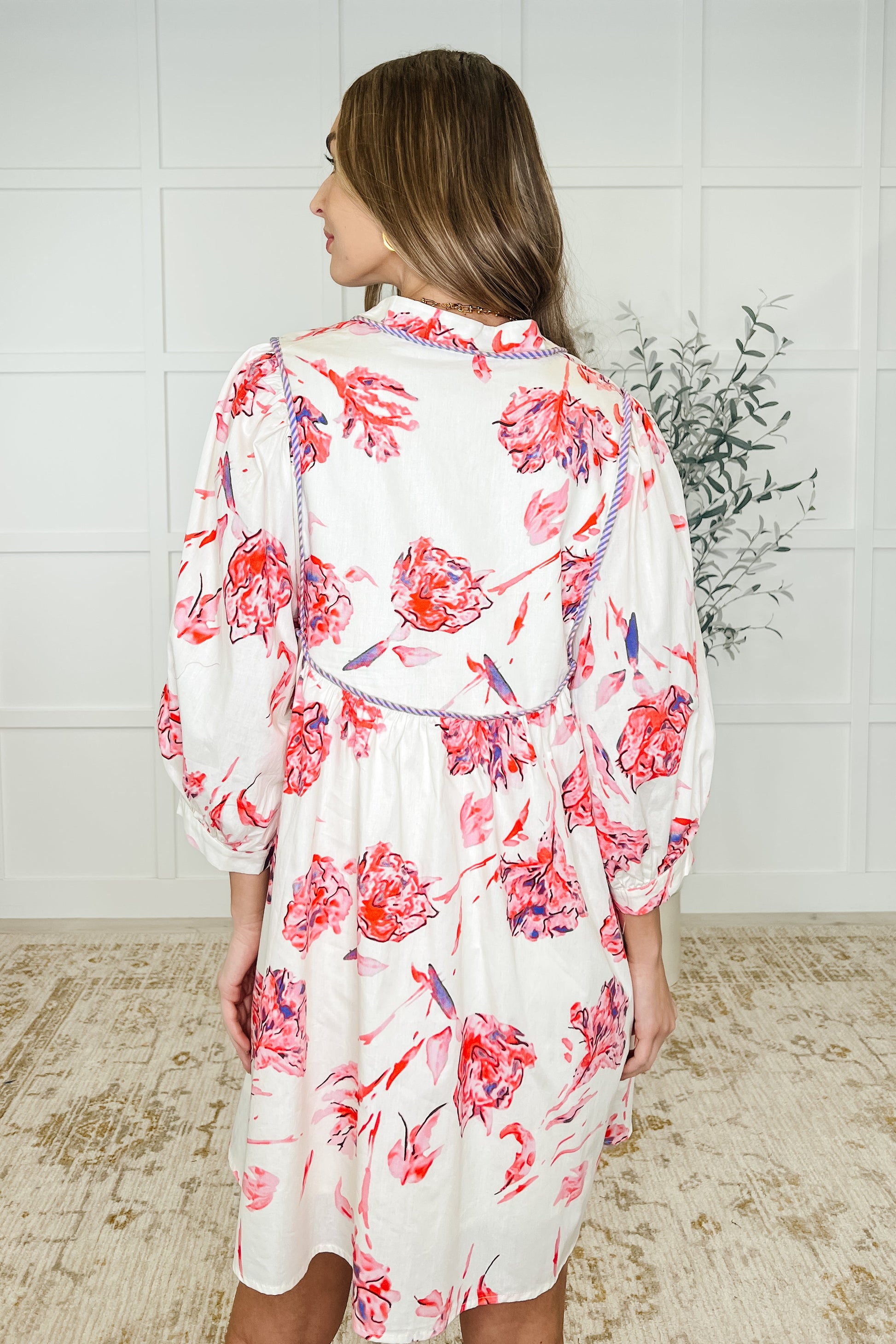 Lightweight Woven
V-Neckline
Functional Neck Tie
Puff Sleeve
Banded Hemline
Contrast Trim Details
Fully Lined Except Sleeves
Functional Side Pockets
100% Cotton
True to Size Floral dress