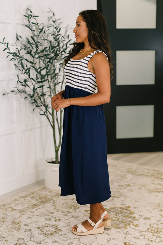 Striped top and navy dress 
Texture Knit Bodice
High Stretch Bodice
Square Neckline
Crinkle Woven Skirt
Functional Side Pockets
100% Polyester
True to Size
